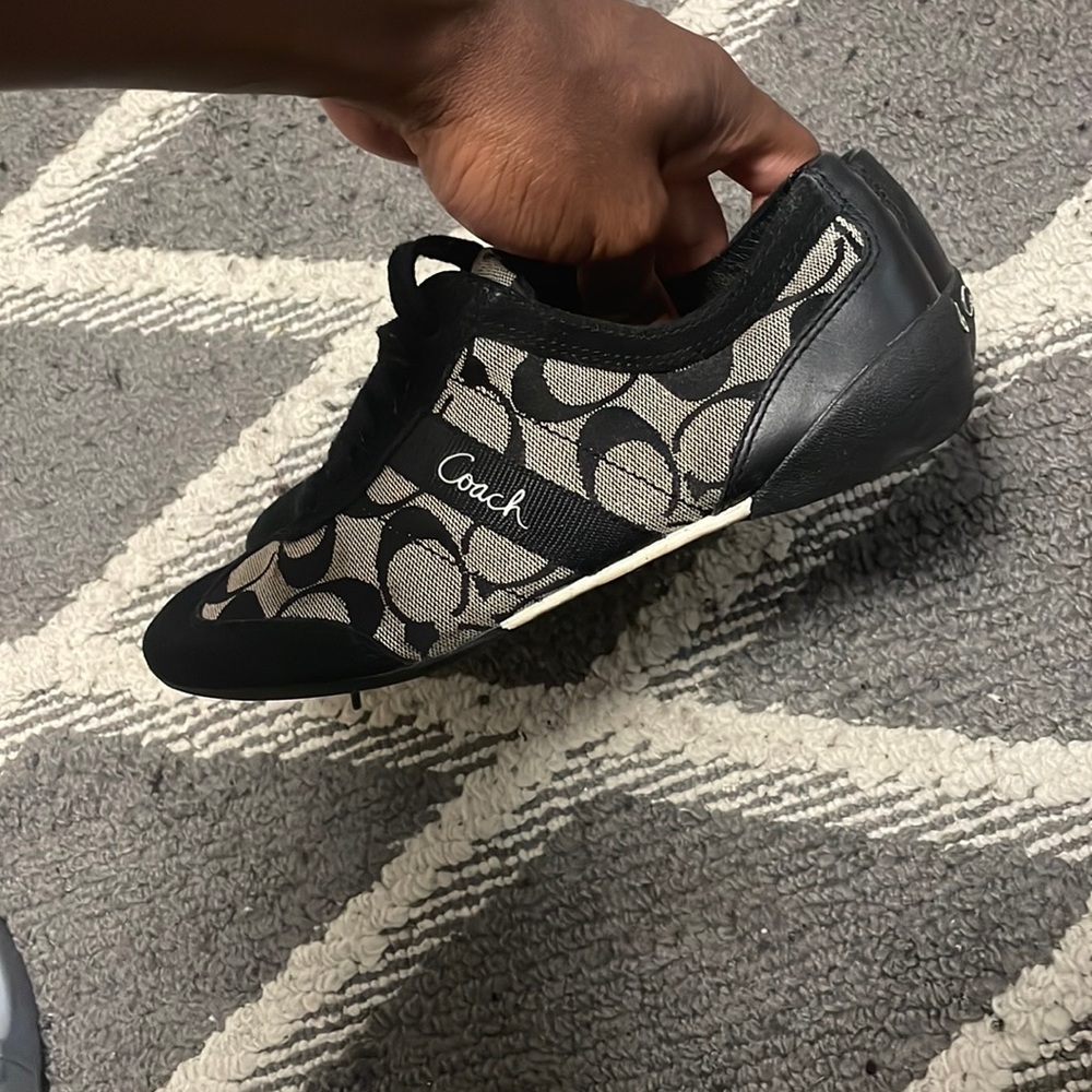This is a size 7 woman coach shoe. Black & Grey